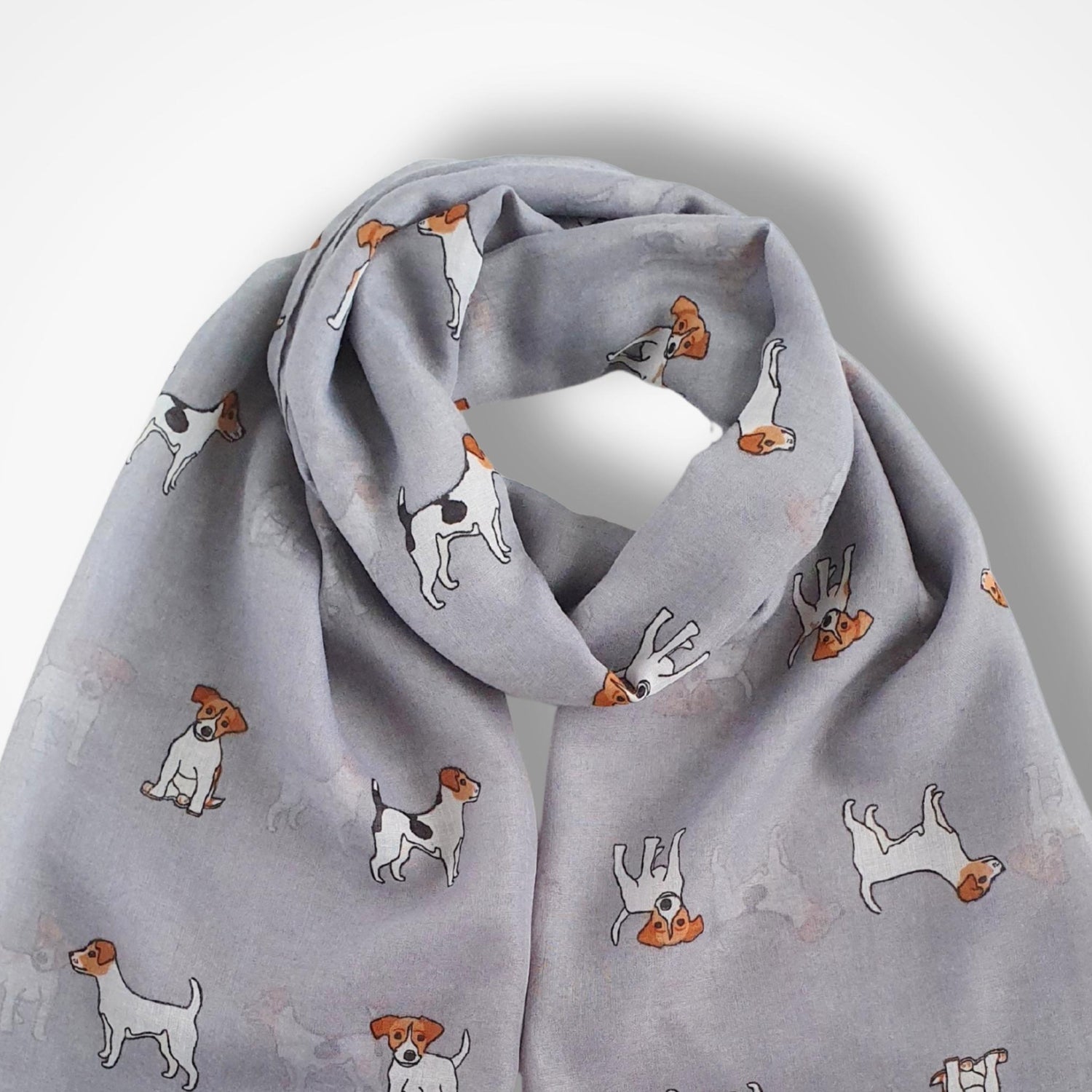 Grey scarf with jack russell dog pattern on a light grey background