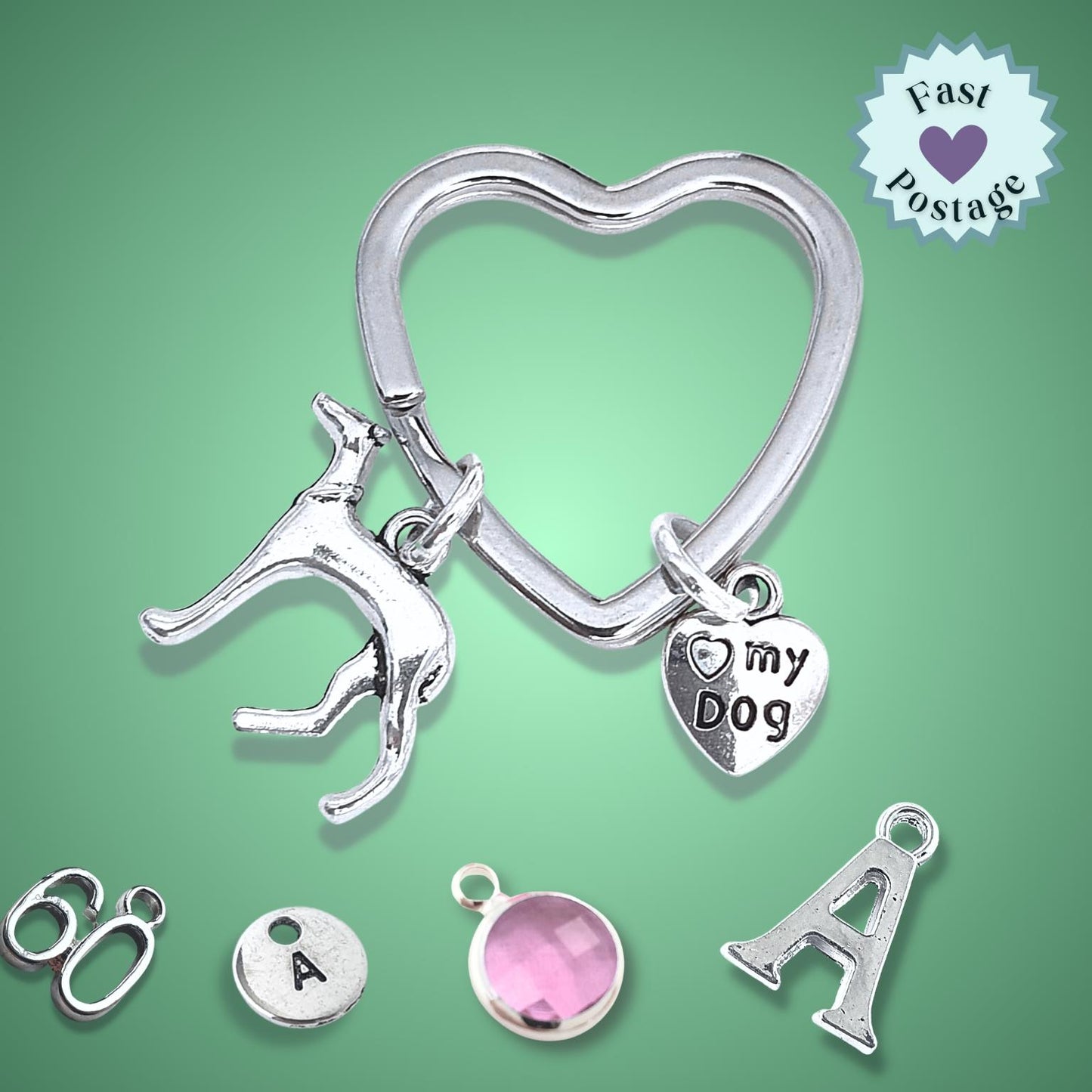 Silver heart-shaped keychain with dog charm and 'I love my dog' tag on a green background