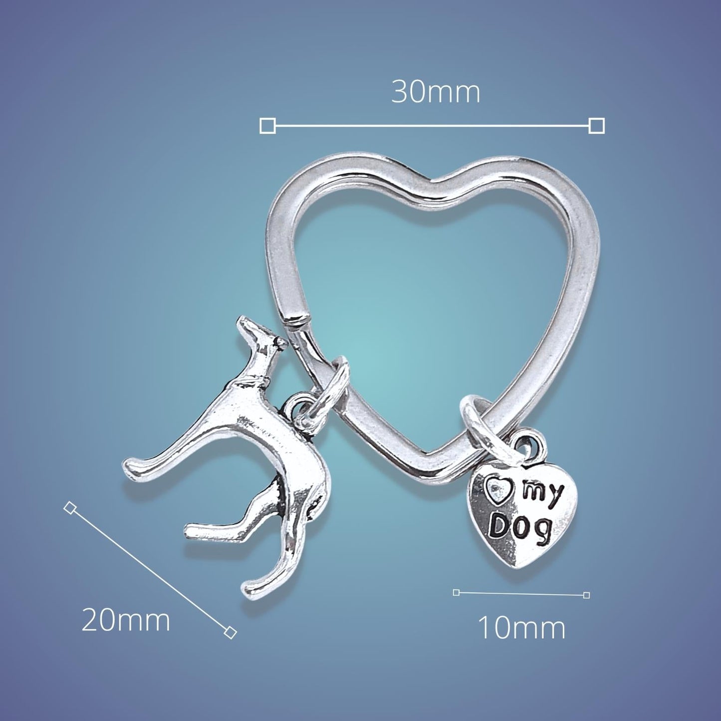 Silver heart-shaped keychain with a dog charm and 'my dog' tag on a blue gradient background