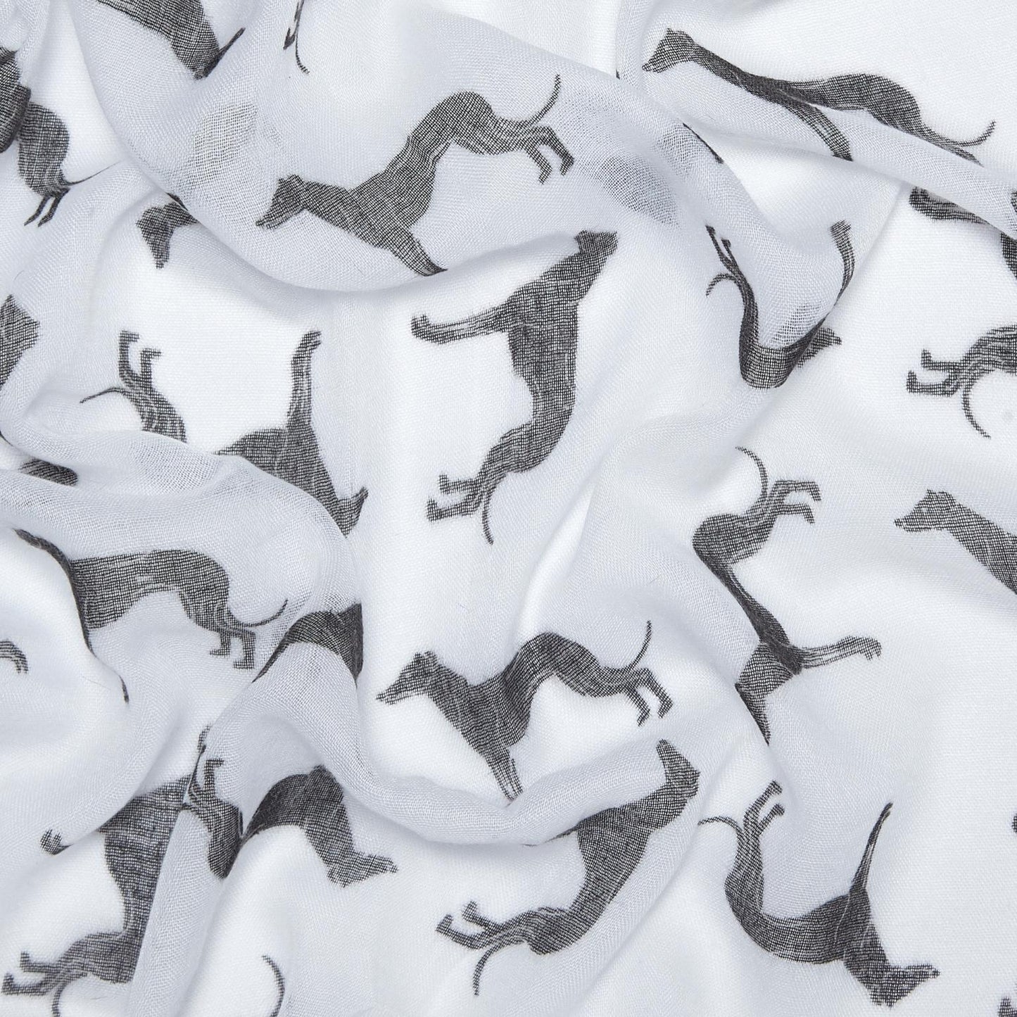 White lightweight fabric with an allover print of black greyhound silhouettes, shown in soft folds.