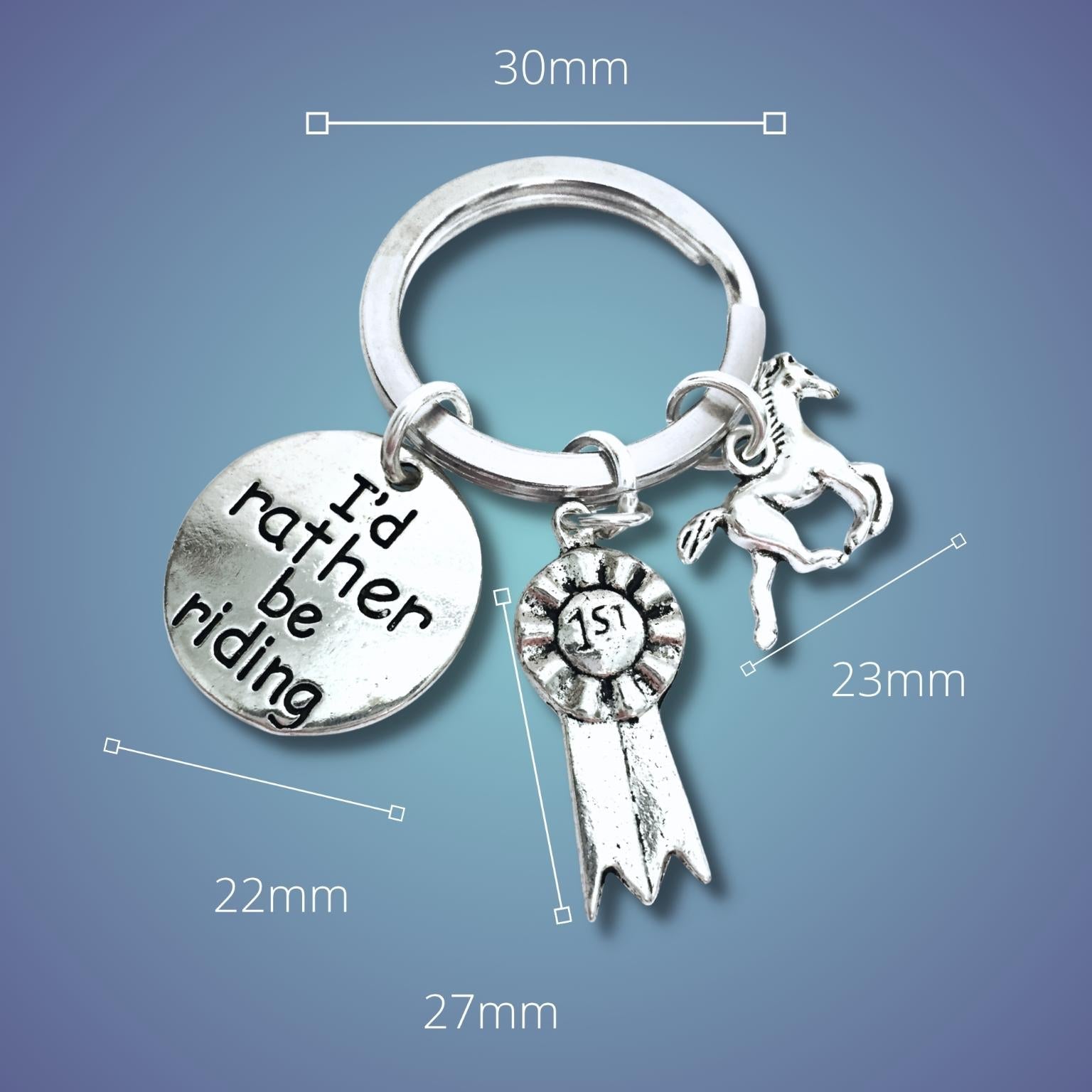 Silver keychain with horse charm and measurement details on a blue background
