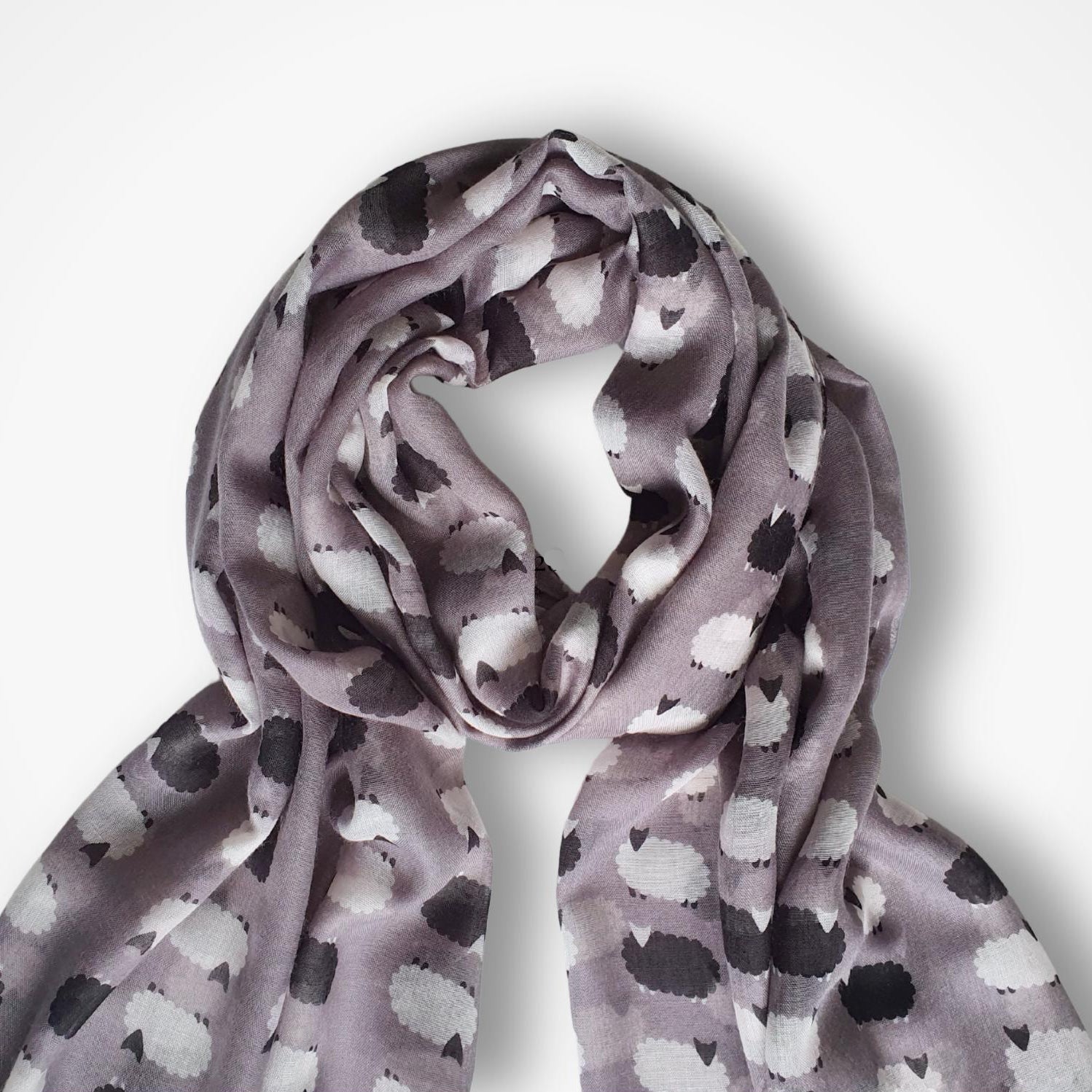 Sheep patterned scarf on a white background