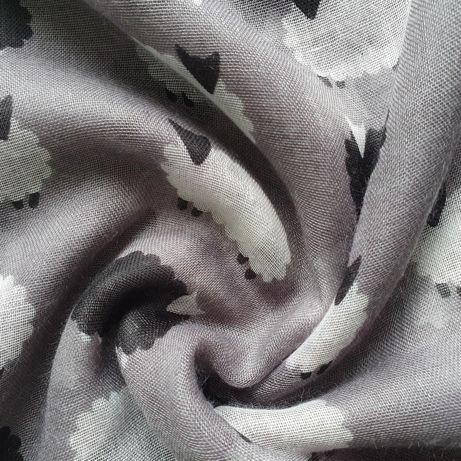 Close-up of fabric with black and white sheep pattern