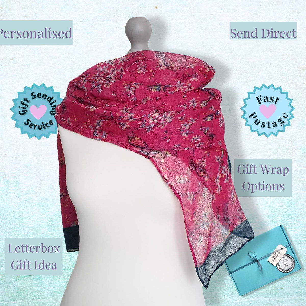 A pink floral scarf draped on a white mannequin torso against a light blue textured background, with promotional text labels including 'Personalised', 'Send Direct', 'Fast Postage', 'Gift Wrapping Service', and 'Letterbox Gift Idea'. A small blue gift box is shown at the lower right.