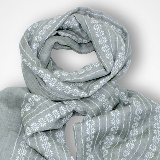 Gray scarf with white floral pattern on a light gray background