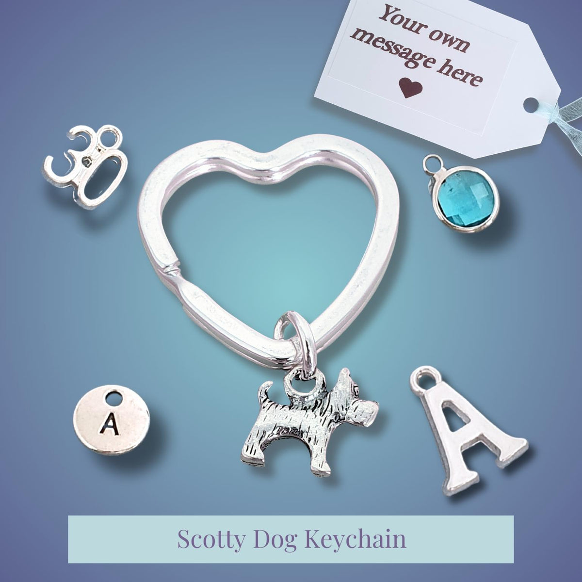 Silver-tone Scotty Dog keychain with a heart-shaped ring, dog charm, and letter A charms, shown with customization options on a blue gradient background.