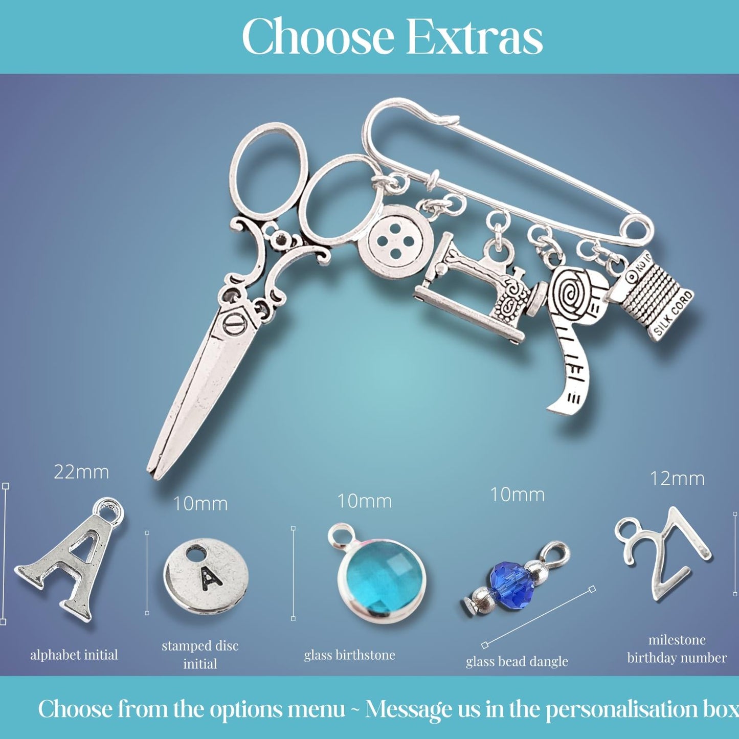 Brooch with sewing themed silver charms including scissors, sewing machine, buttons, and other items on a blue gradient background.