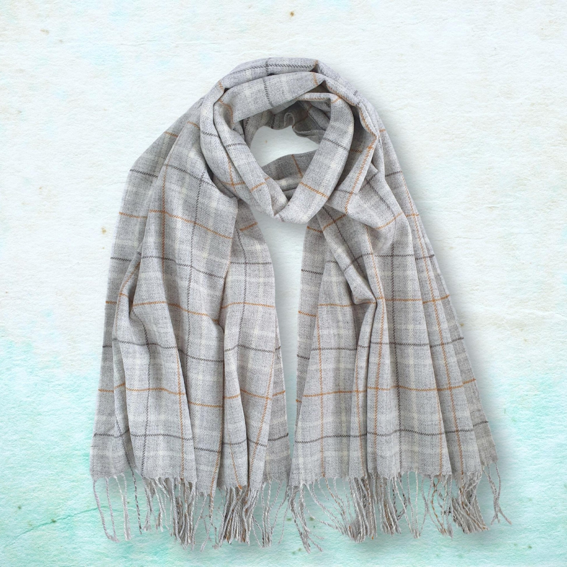 Plaid scarf on a light blue textured background