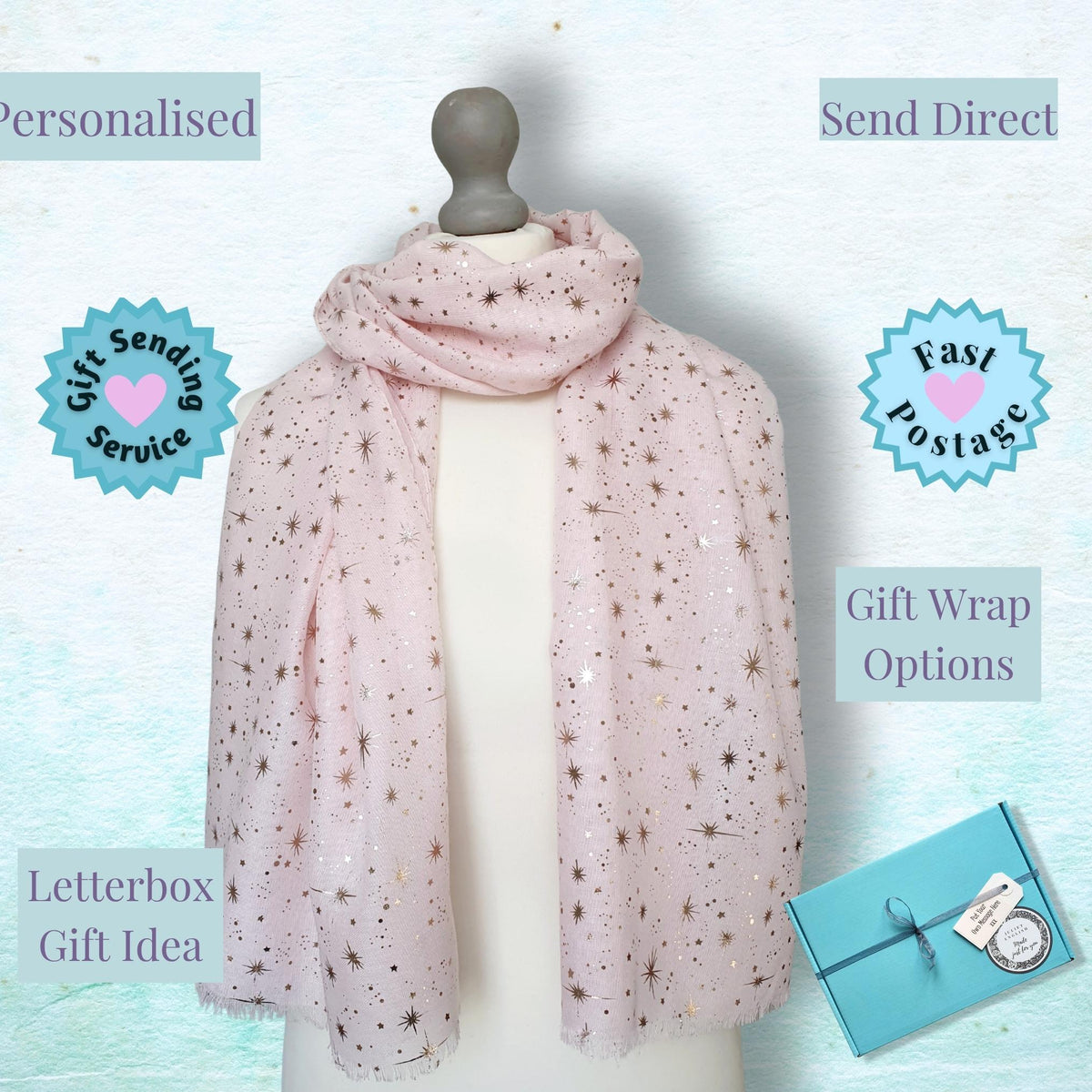 A light pink scarf with small metallic star embellishments displayed on a mannequin torso. The image includes promotional text labels such as 'Personalised', 'Send Direct', 'Fast Postage', 'Gift Wrapping Options', and 'Letterbox Gift Idea', along with a small blue gift box in the lower right corner.
