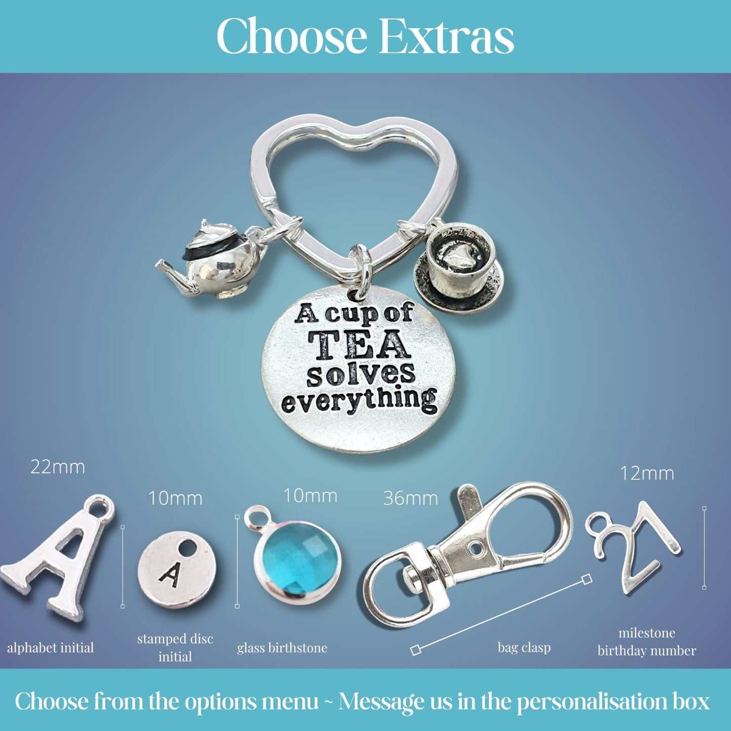 Personalised charm keychain customization options displayed on a blue gradient background, featuring a heart-shaped keychain with a teapot, coffee cup, and round charm engraved with 'A cup of TEA solves everything', plus dimensioned and labeled alternative charms and clasp options below.