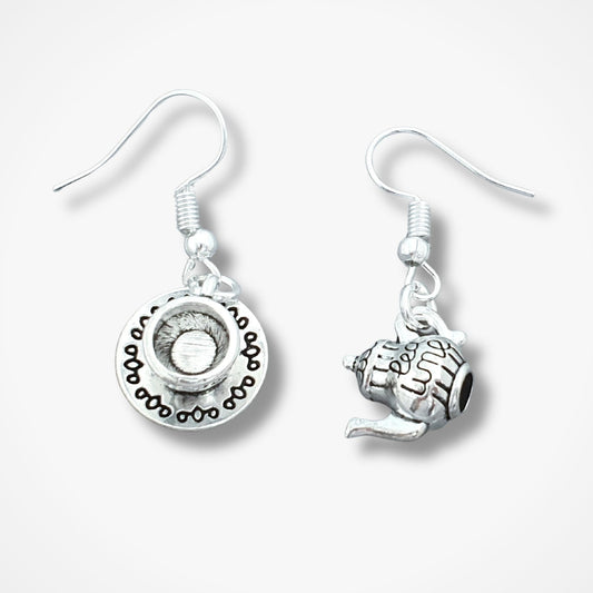 Pair of silver teapot and teacup earrings on a white background