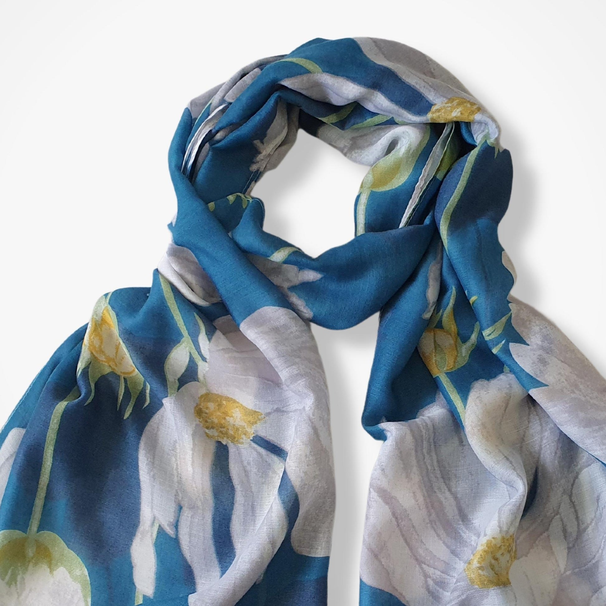 Floral patterned scarf with blue, white, and yellow colors on a white background