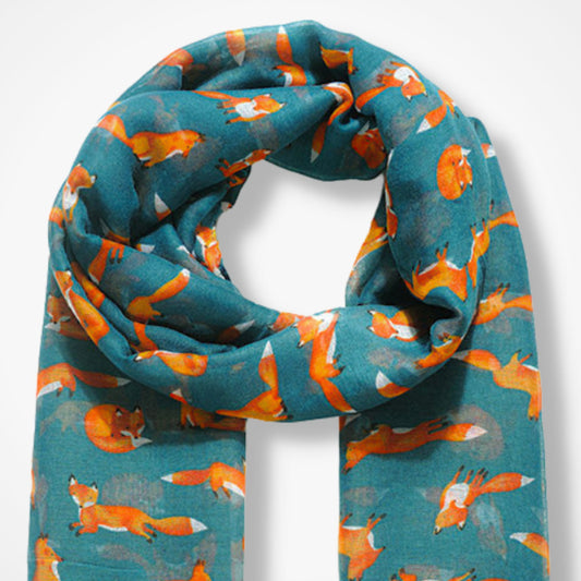 Teal scarf with fox pattern on a white background
