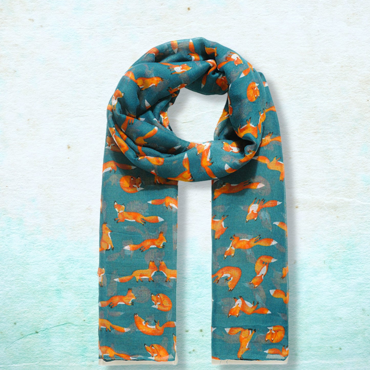 Scarf with fox pattern on a light blue background