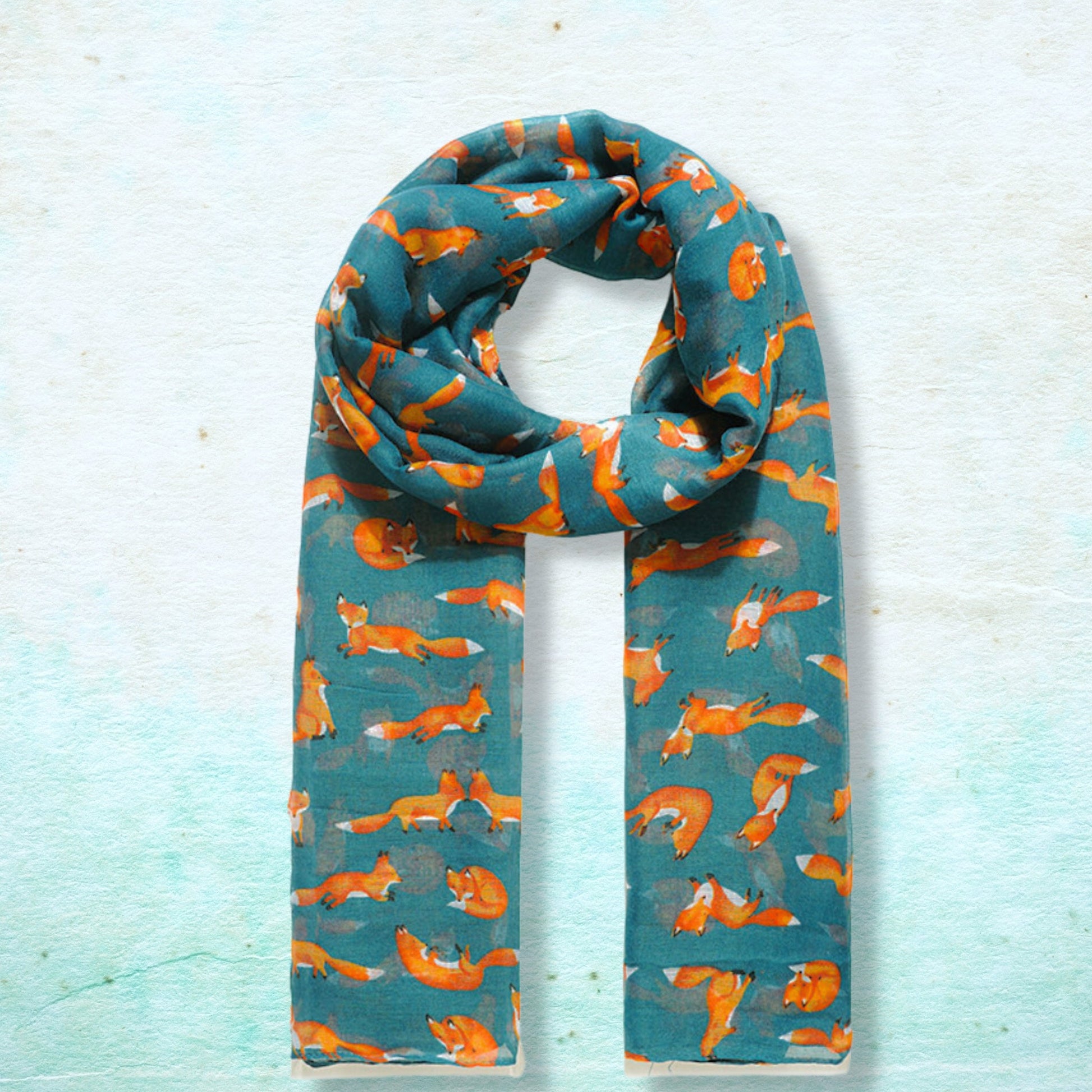 Scarf with fox pattern on a light blue background