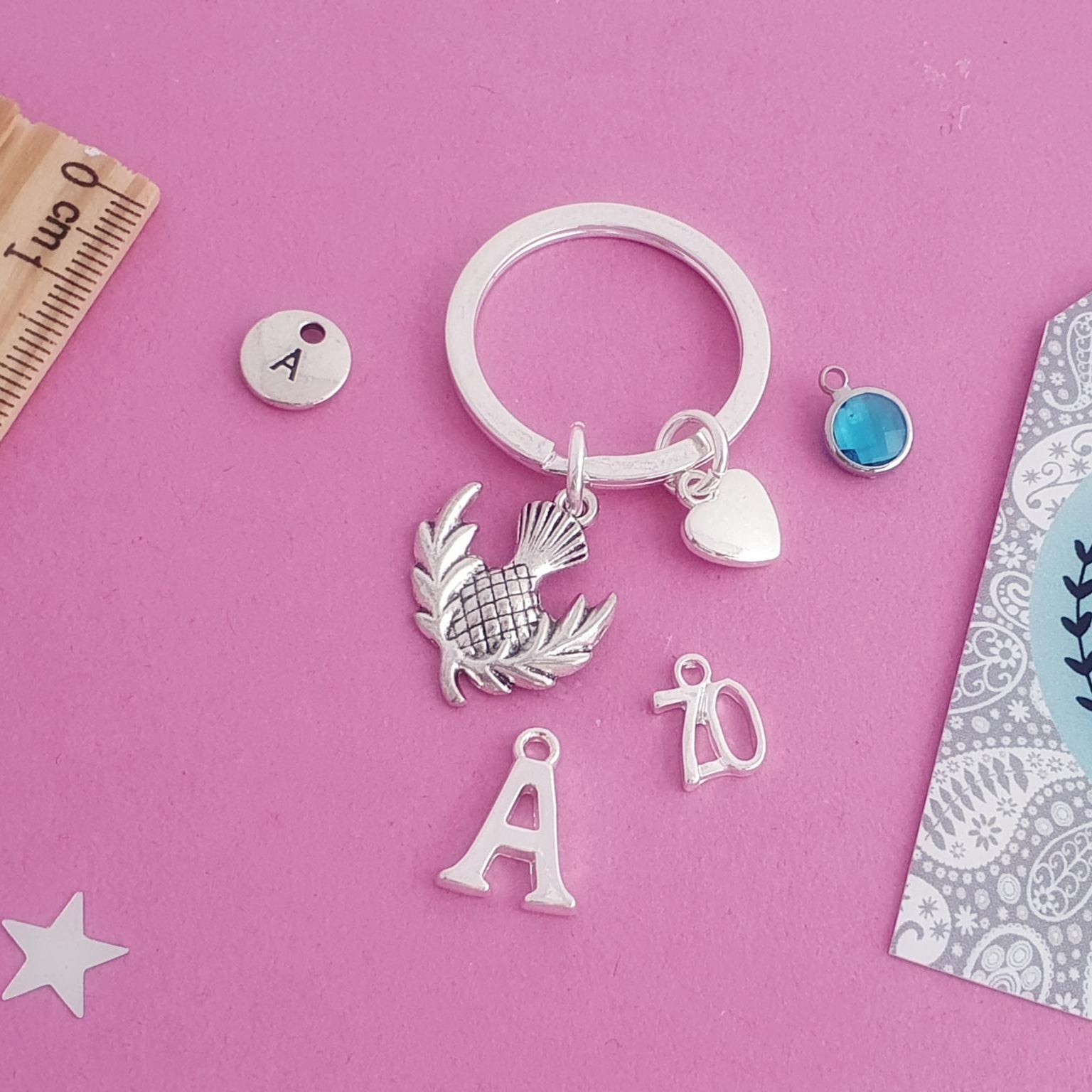 Keychain with charms on a pink background