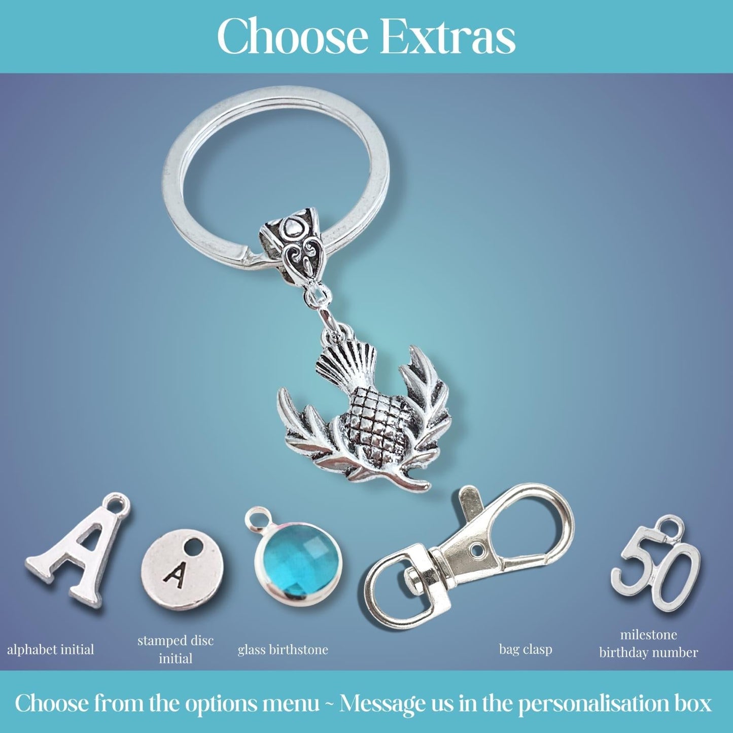 Silver keychain customization options displayed on a blue gradient background, featuring a thistle charm, clasp, and customizable letter and number charms with labels.