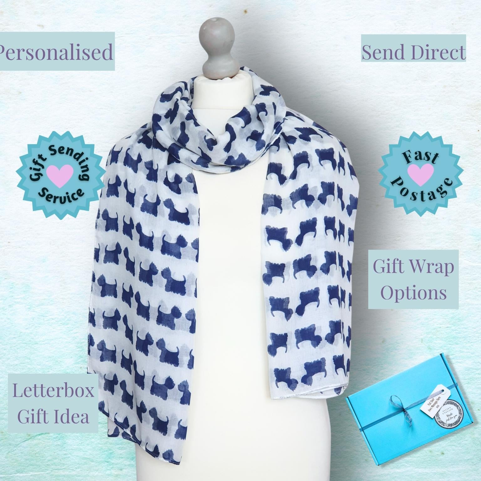 A white scarf with a navy blue Scottish terrier dog pattern is displayed on a white mannequin torso. The background is a textured light blue, and several promotional text overlays and badges are present, including 'Personalised', 'Send Direct', 'Fast Postage', 'Letterbox Gift Idea', and 'Gift Wrap Options'.