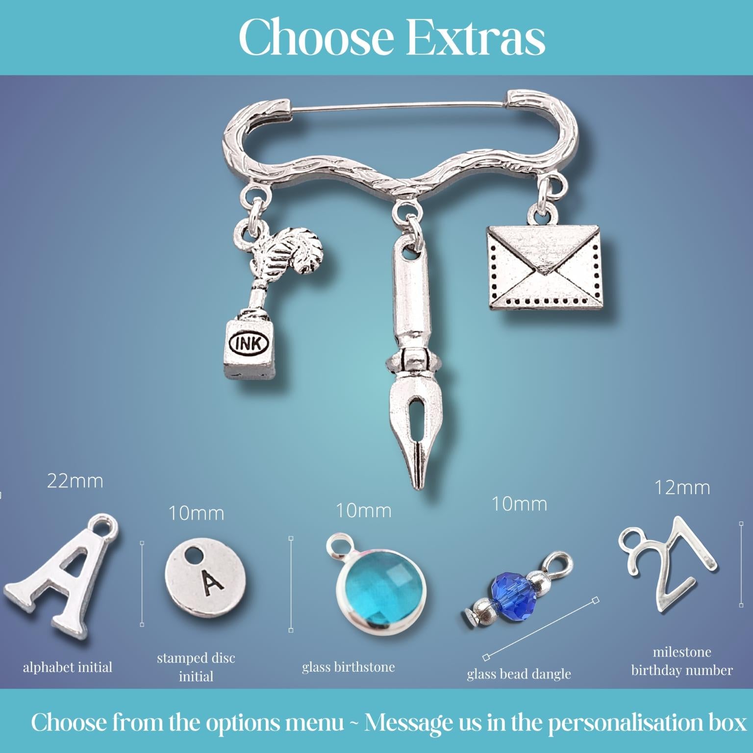 A promotional graphic for a silver charm brooch showing a main clasp with several dangling charms, plus smaller option illustrations labeled with sizes and types such as alphabet initial, stamped disc initial, glass beadstone, and milestone number. The top text reads 'Choose Extras' and the bottom text says 'Choose from the options menu - Message us in the personalisation box.