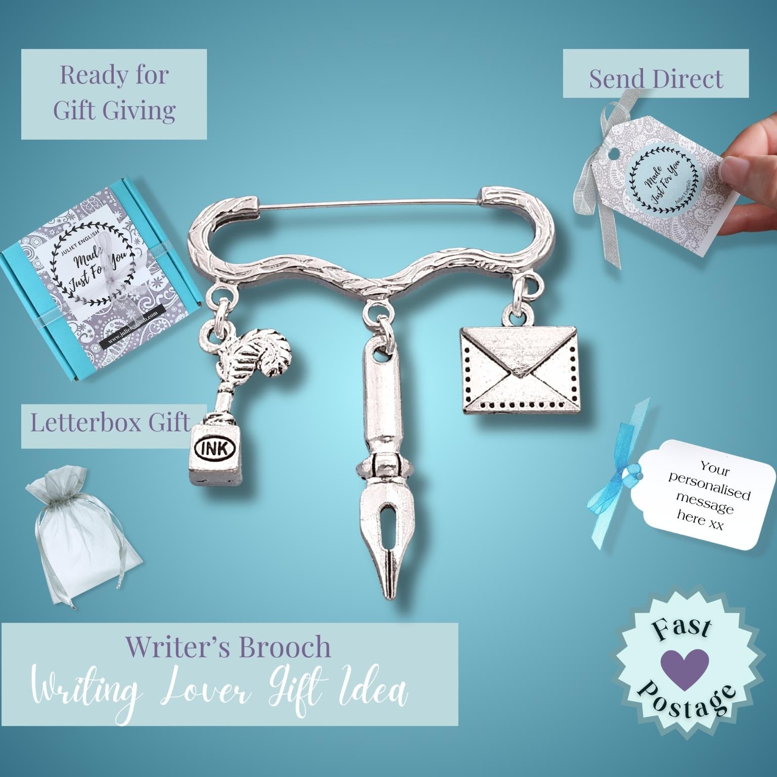 A silver-toned brooch shaped like a pen with hanging charms including a horse, book, letter envelope, and ink drop, shown on a blue background with gift-themed labels and a hand holding a tag.